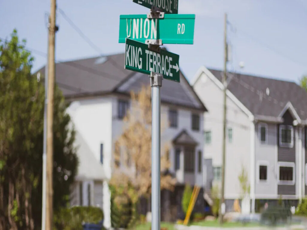 OPTSIGNS | Top vs. Side Mount Street Sign Brackets: Which One to Use?
