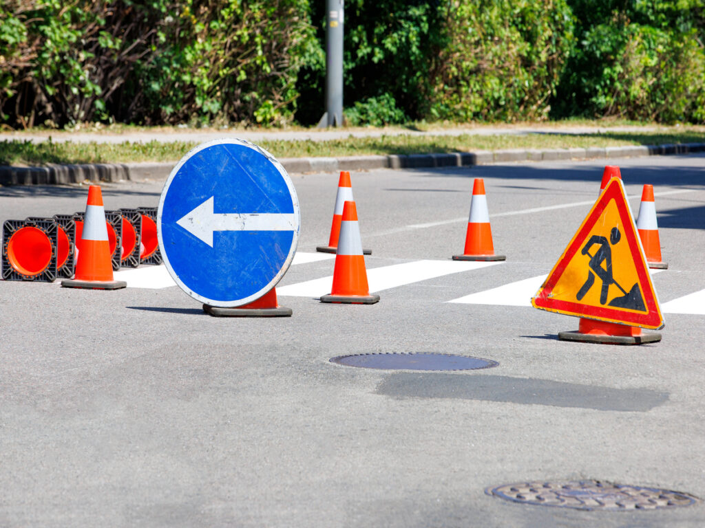 OPTSIGNS | Traffic Cone Signs vs. Portable Sign Frames: Which One Should You Use?
