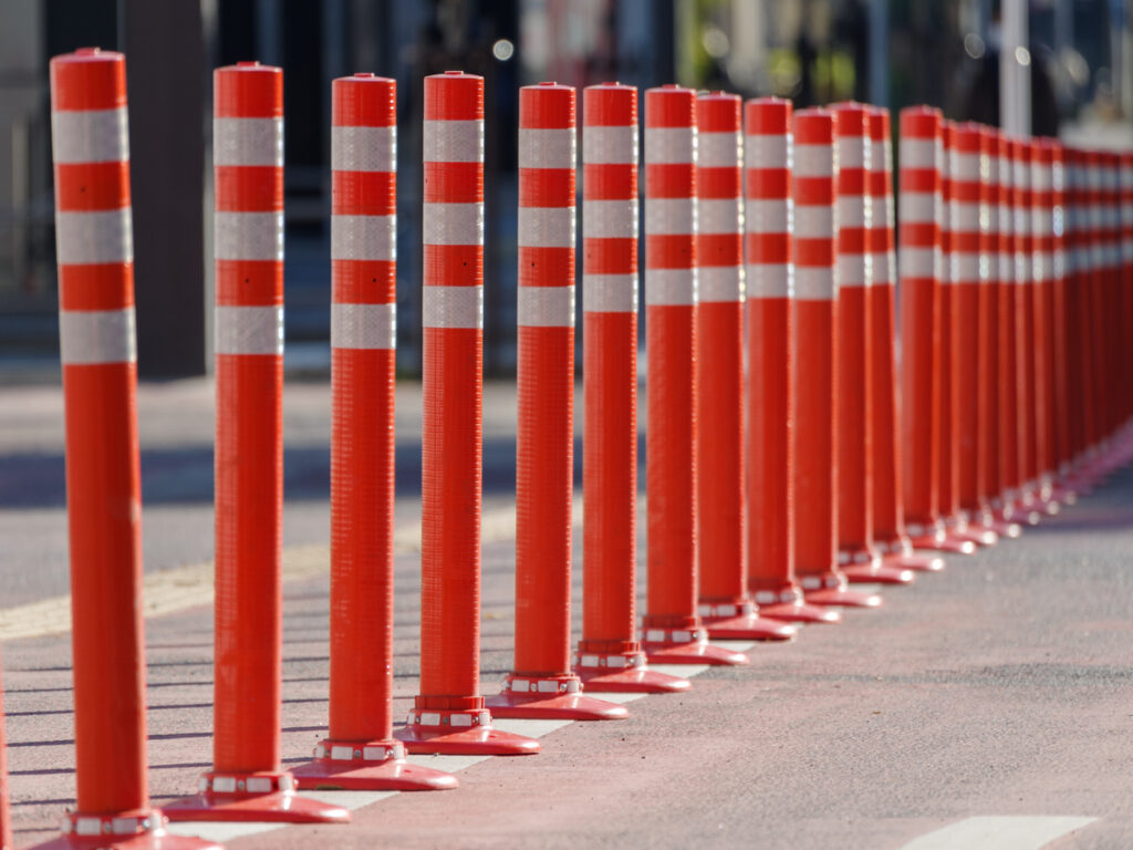 OPTSIGNS | The Right Use Cases for Plastic Traffic Bollards (And When to Upgrade to Steel)
