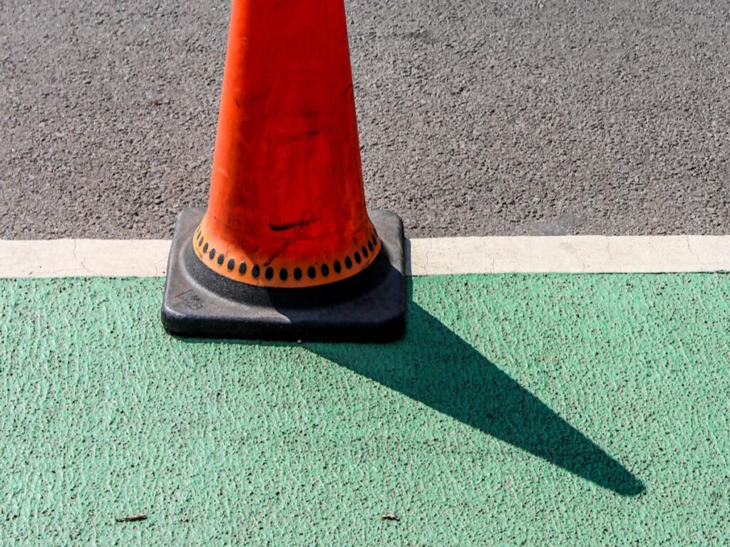 OPTSIGNS | The 3-Second Rule: How Color Psychology in Cones Cuts Driver Lane Deviation by 40%