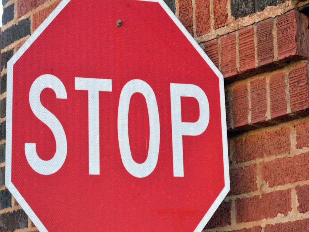 OPTSIGNS | What Are Black Dot Stop Signs Made Of? Materials, Reflectivity, and Durability