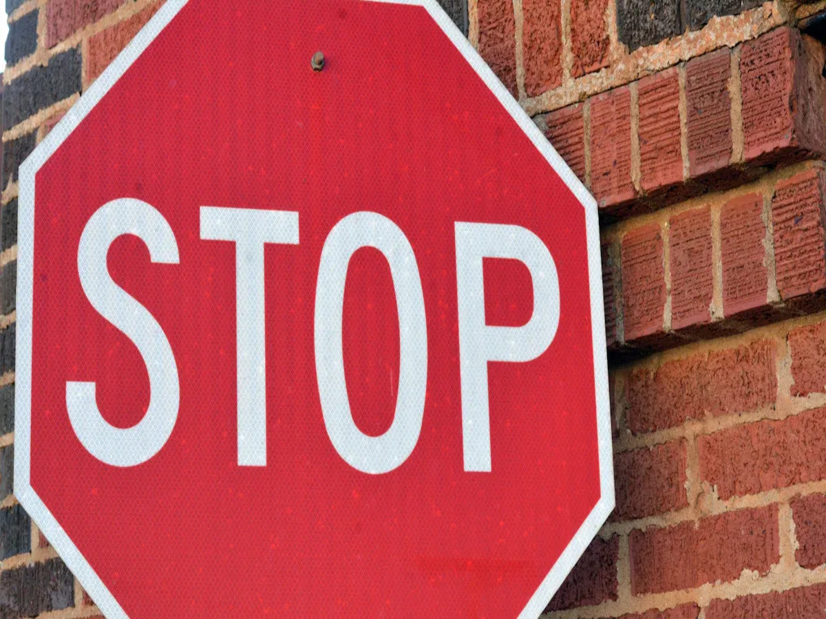 OPTSIGNS | What Are Black Dot Stop Signs Made Of? Materials, Reflectivity, and Durability