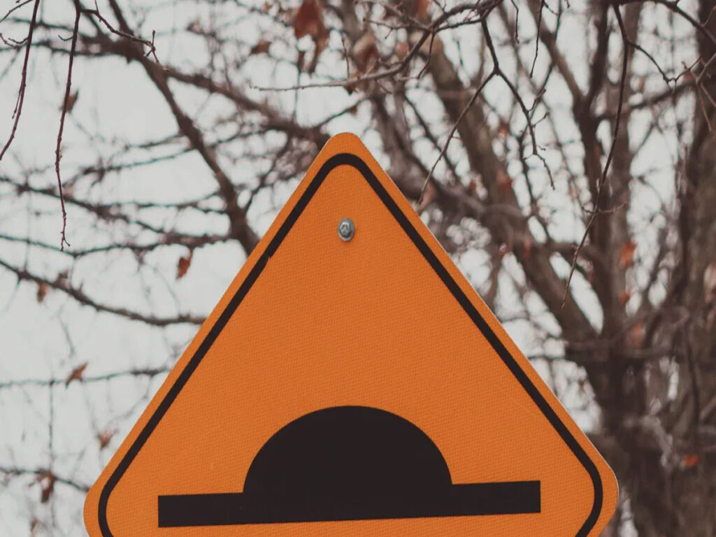 OPTSIGNS | STOP Signs vs Speed Humps: Which Is Better for Traffic Calming?