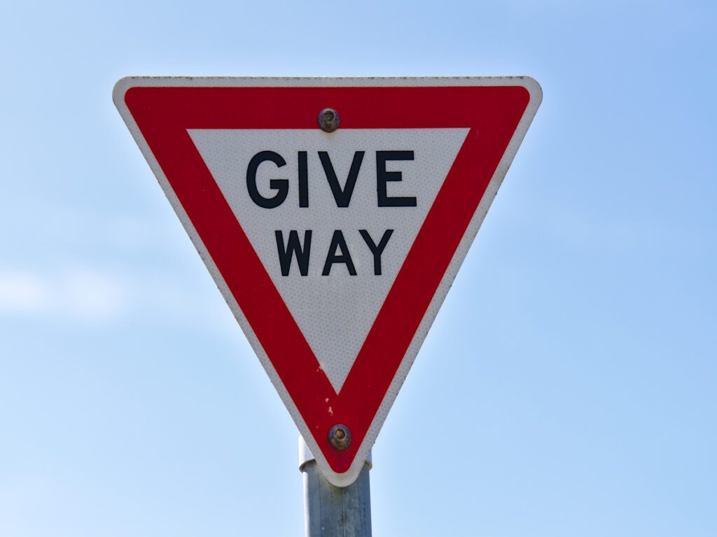 OPTSIGNS | Why STOP Signs Are Rare in the UK: Understanding British Road Sign Strategy