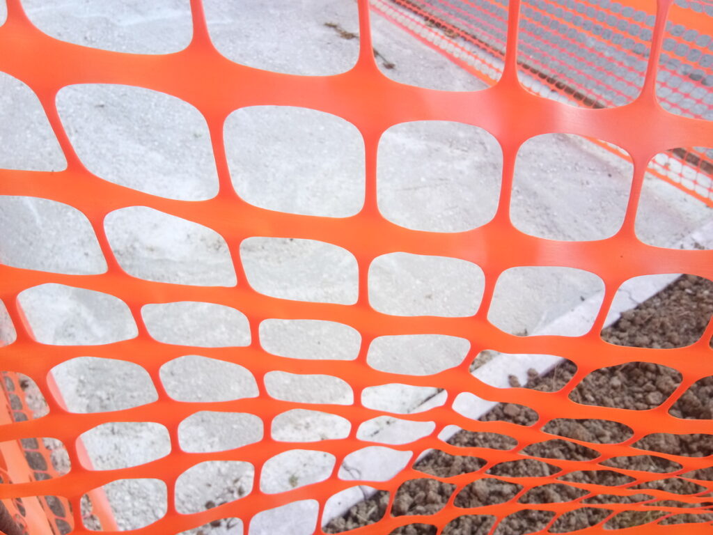 OPTSIGNS | How to Secure an Orange Construction Fence: Tips for Safe and Effective Installation