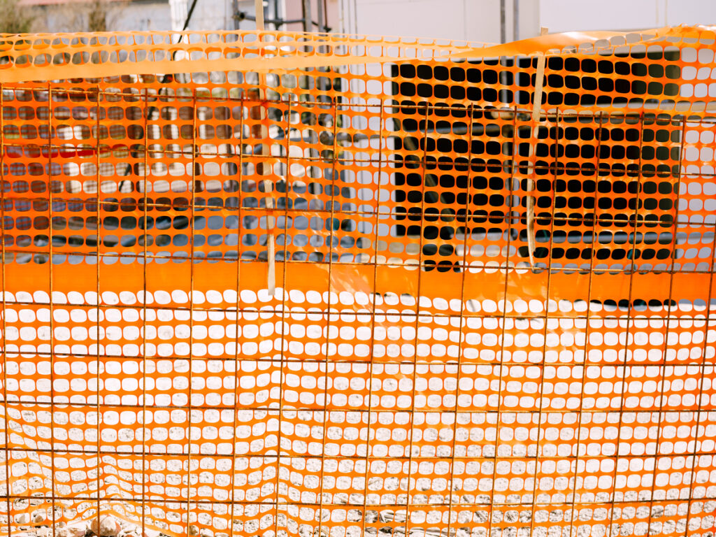 OPTSIGNS | How to Secure an Orange Construction Fence: Tips for Safe and Effective Installation
