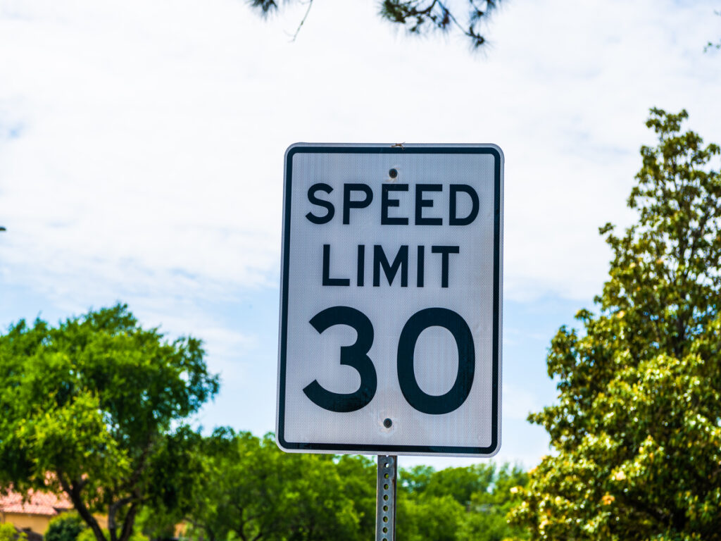 OPTSIGNS | What Sets Yellow Speed Limit Signs Apart from White Speed Limit Signs