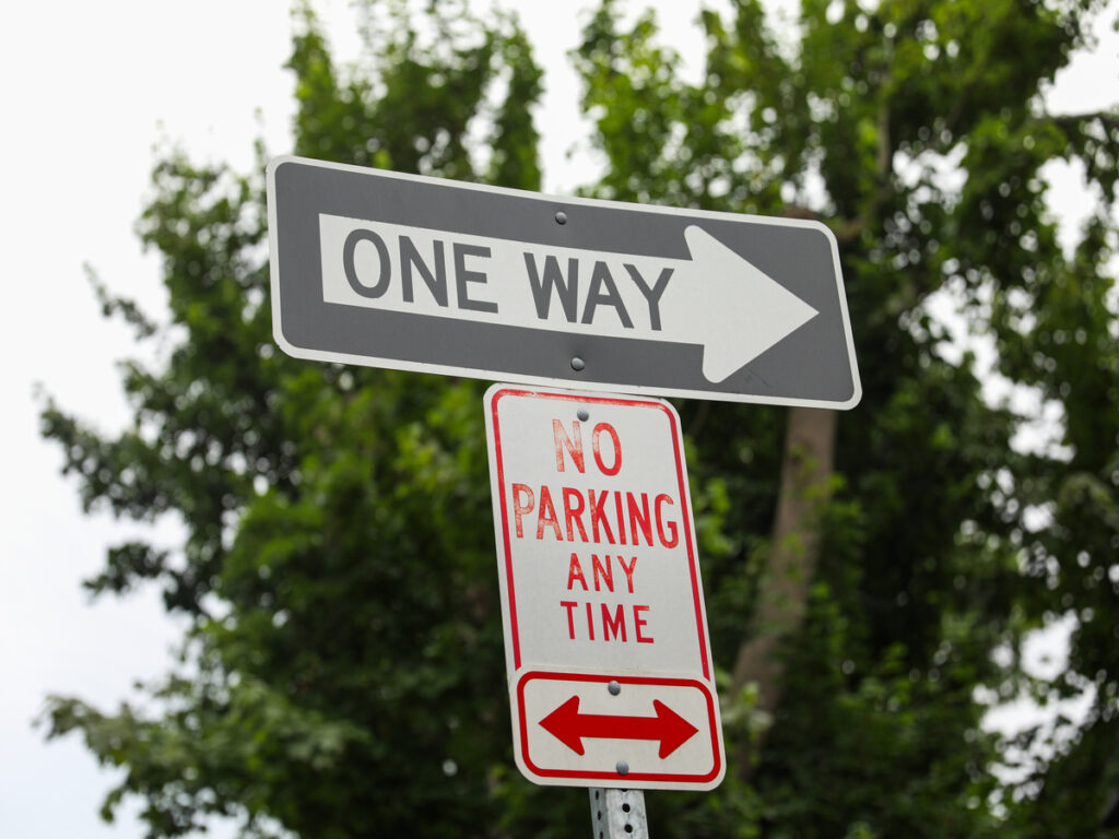 OPTSIGNS | The Role of Arrows on Parking Signs: Left, Right, and Double-Arrow Rules