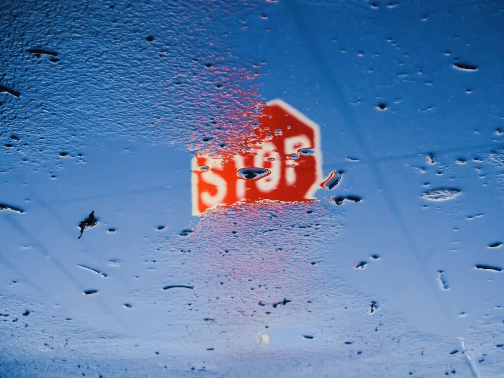 OPTSIGNS | Brushed Metal Signs in Rain: Why Durability and Visibility Matter for Your Business